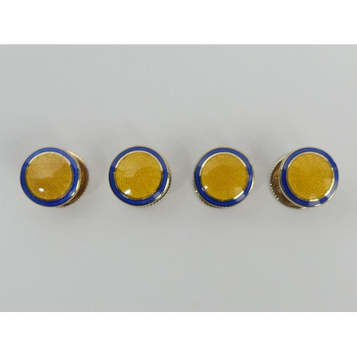 99 - A set of 9ct gold and enamel cufflinks and dress studs in a fitted box. Birm. 2006, 25
3 grams.  UK ... 