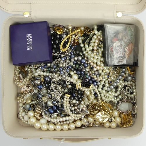 100A - A box of costume jewellery including bead necklaces and silver pendants. UK Postage £12.