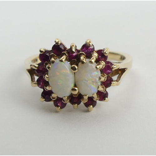 106 - 9ct gold double opal and ruby cluster ring, 3.1 grams, size N1/2.  UK Postage £12.