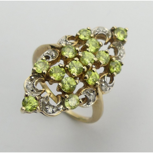 107 - 9ct peridot and diamond fancy set ring, 4.6 grams, 28mm long, 11.8 diameter, size N 1/2.  UK Postage... 