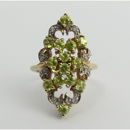 107 - 9ct peridot and diamond fancy set ring, 4.6 grams, 28mm long, 11.8 diameter, size N 1/2.  UK Postage... 