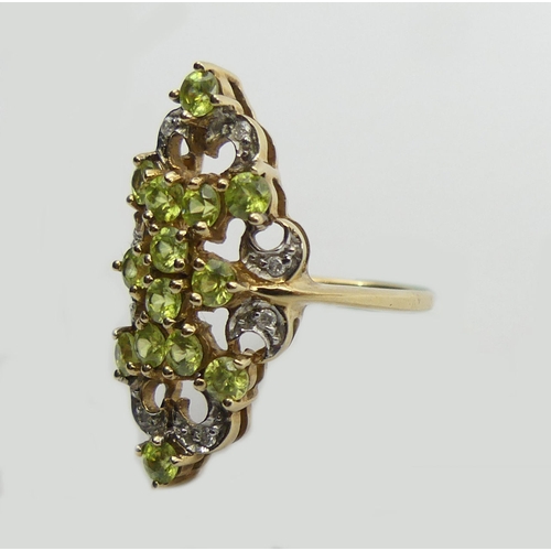 107 - 9ct peridot and diamond fancy set ring, 4.6 grams, 28mm long, 11.8 diameter, size N 1/2.  UK Postage... 