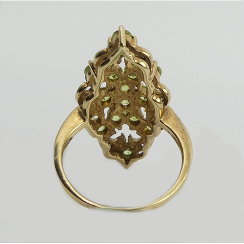 107 - 9ct peridot and diamond fancy set ring, 4.6 grams, 28mm long, 11.8 diameter, size N 1/2.  UK Postage... 