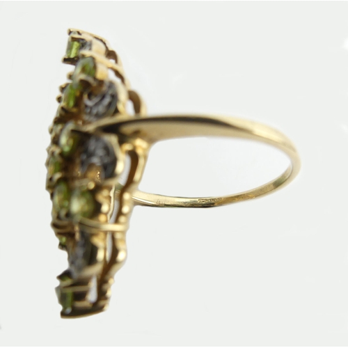 107 - 9ct peridot and diamond fancy set ring, 4.6 grams, 28mm long, 11.8 diameter, size N 1/2.  UK Postage... 