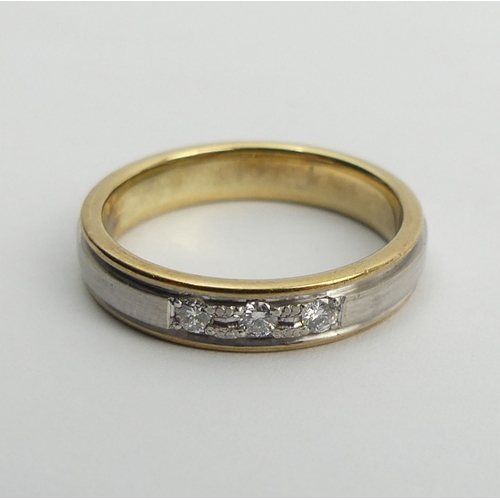 110 - 9ct two colour gold diamond, three stone ring, 3.7 grams, 4mm, size M. UK Postage £12.