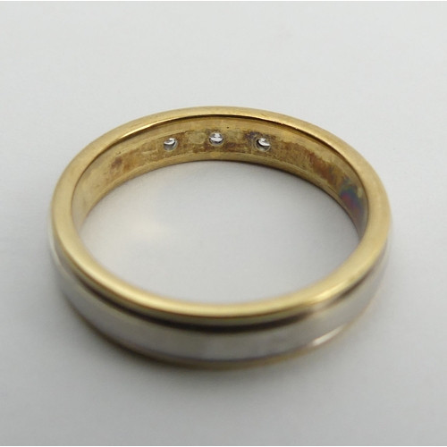 110 - 9ct two colour gold diamond, three stone ring, 3.7 grams, 4mm, size M. UK Postage £12.