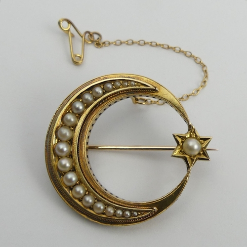 121 - 15ct gold (tested) star and moon brooch set with seed pearls, 7.3 grams. UK Postage £12.