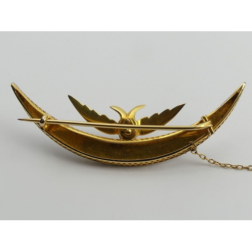 122 - 15ct gold (tested) bird and crescent brooch set with seed pearls, 10.4 grams. UK Postage £12.