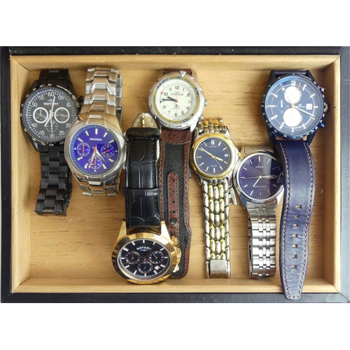 149 - A box of seven gents watches including a Rotary gold tone Chronometer. UK Postage £12.