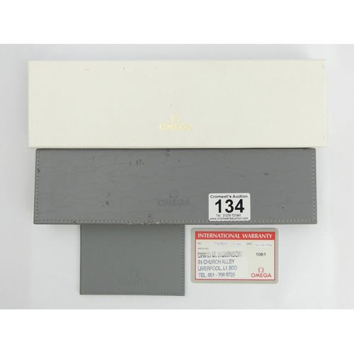 134 - Ladies Omega De Ville date adjust watch with the original box and warranty card. UK Postage £12.
Con... 