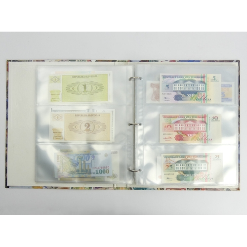 200G - Three folders of un-circulated bank notes from around the world. UK Postage £16.