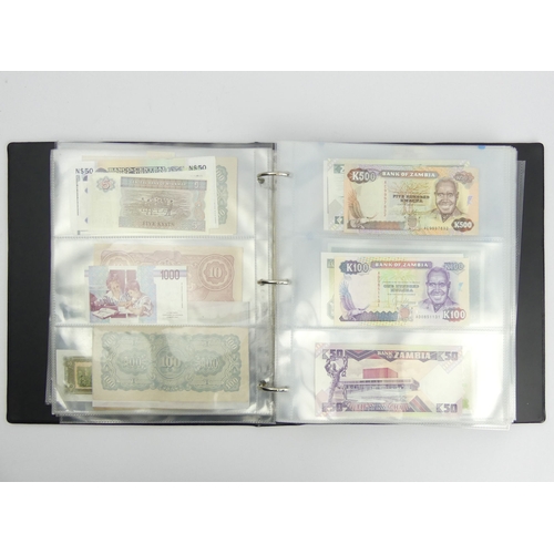 200G - Three folders of un-circulated bank notes from around the world. UK Postage £16.