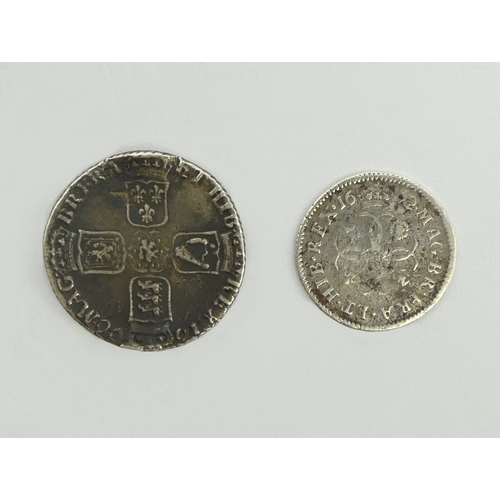 219 - Charles II silver 1672 three pence and a William III shilling.