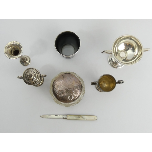 238 - A group of silver items including a pepperette, Chester 1932, 161 grams weighable. UK Postage £12.