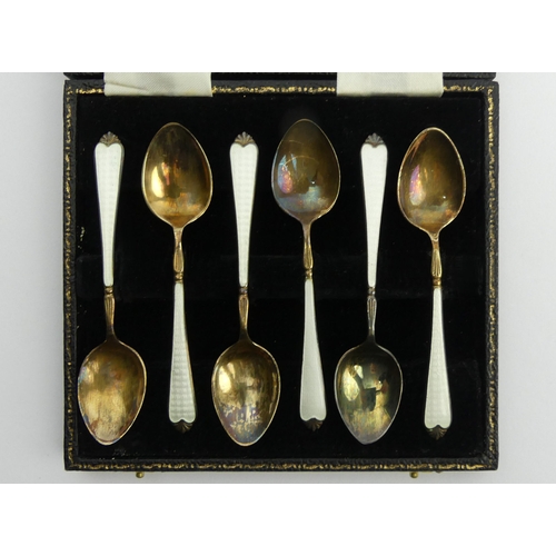 249 - A cased set of six silver and enamel tea spoons, Birm. 1957, 72.8 grams, 9.5cm. UK Postage £12.