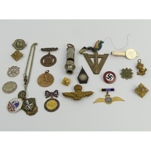 257 - A box of military cap badges and other items of interest. UK Postage £12.