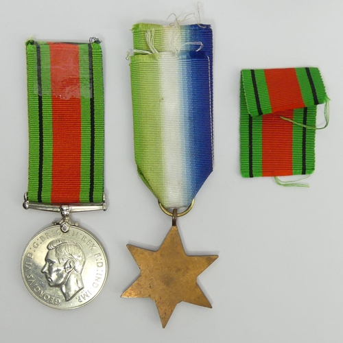 264 - World War II defence medal and the Atlantic star. UK Postage £12.