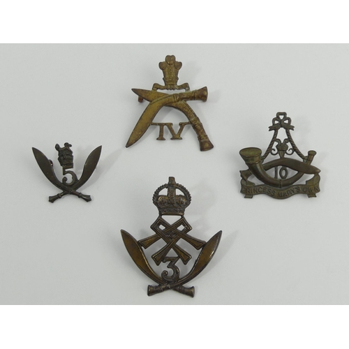 272 - Four Gurkha Regiment cap badges. UK Postage £12.