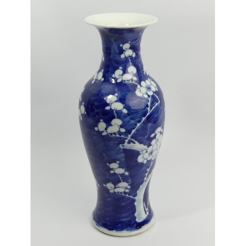 305 - Chinese blue & white prunus design porcelain vase, character marks to the underside, 30cm. UK Postag... 