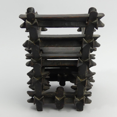 305A - An unusual oriental carved wood lacquered miniature chair which, when shaken, rattles, stamped 1830,... 