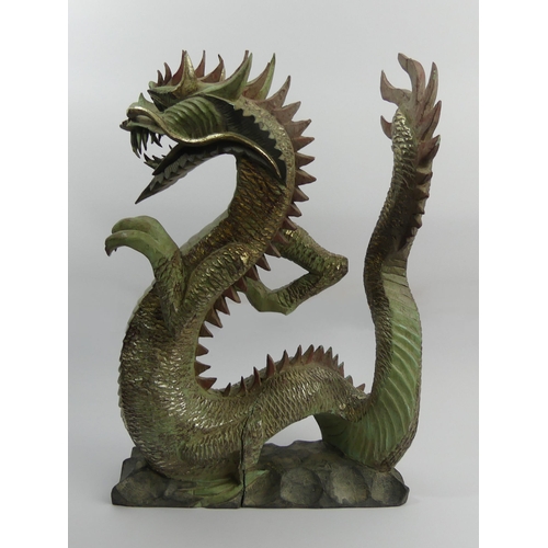 312 - Chinese carved and painted wooden figure of a dragon, 44cm. UK Postage £20.