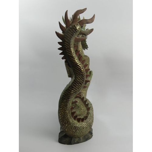 312 - Chinese carved and painted wooden figure of a dragon, 44cm. UK Postage £20.