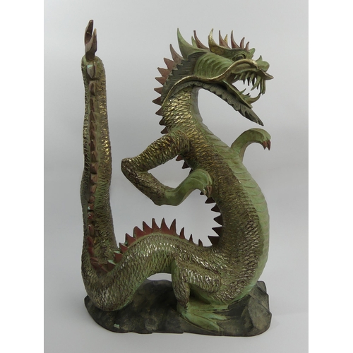 312 - Chinese carved and painted wooden figure of a dragon, 44cm. UK Postage £20.