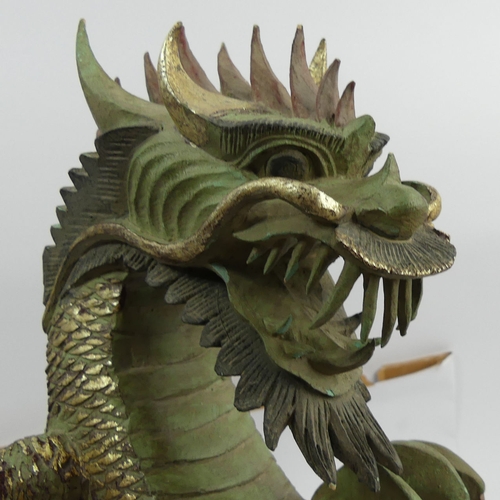 312 - Chinese carved and painted wooden figure of a dragon, 44cm. UK Postage £20.