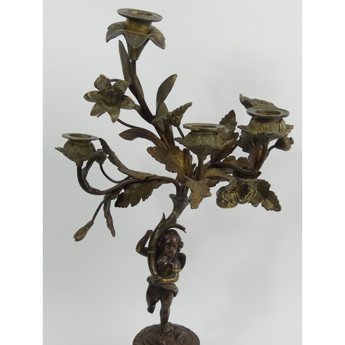 375C - 19th century bronze figural candelabrum with an inset porcelain panel. 46cm high. UK Postage £20.