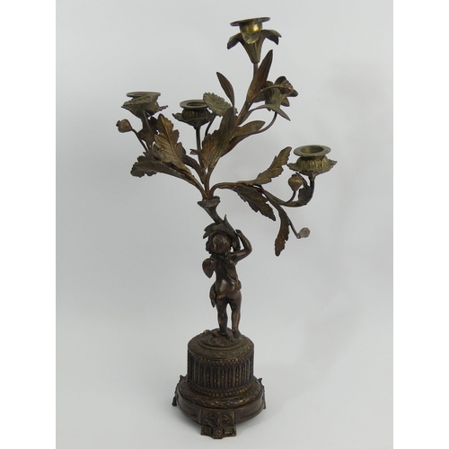 375C - 19th century bronze figural candelabrum with an inset porcelain panel. 46cm high. UK Postage £20.