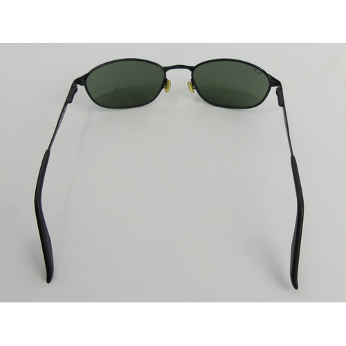 380A - A pair of black framed Ray Ban sunglasses. UK Postage £12.