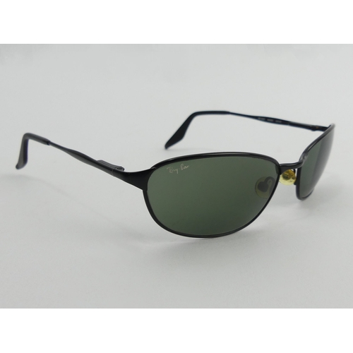 380A - A pair of black framed Ray Ban sunglasses. UK Postage £12.