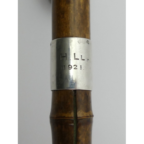 394E - A Brigg bamboo walking stick with a kosh inside and a silver collar, London 1920, 97cm. UK Postage £... 