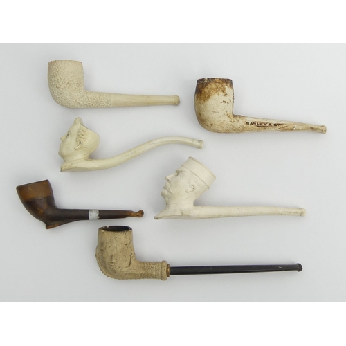 405 - Six clay pipes including a French general with a monocle, a man, claw, billiard shape cutty marked W... 