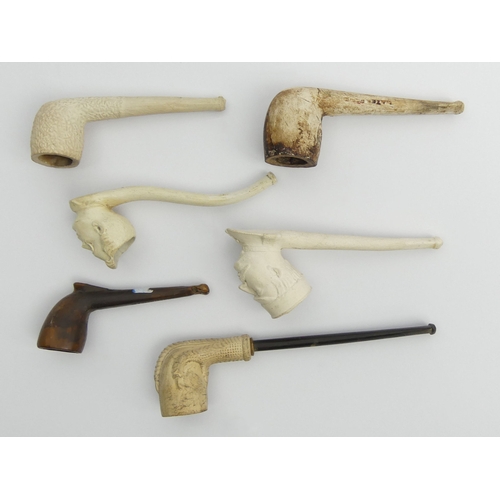 405 - Six clay pipes including a French general with a monocle, a man, claw, billiard shape cutty marked W... 