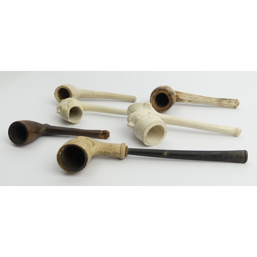 405 - Six clay pipes including a French general with a monocle, a man, claw, billiard shape cutty marked W... 