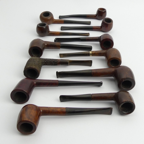 431 - Twelve vintage pre-smoked medium size briar pipes, all in reasonable condition.
UK Postage £12.