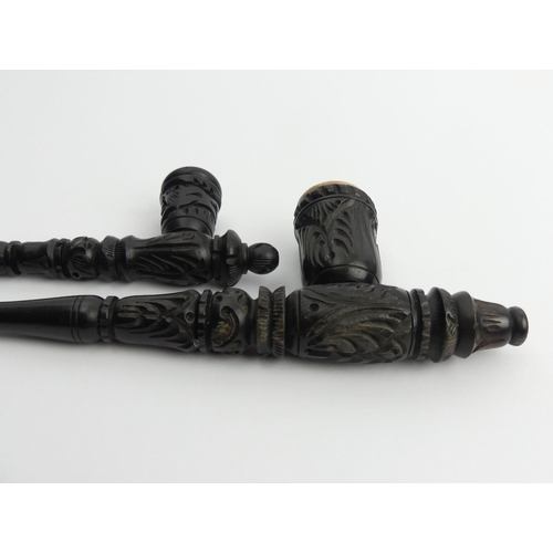 450 - Two carved wood Greek pipes, one with a meerschaum liner. UK Postage £12.