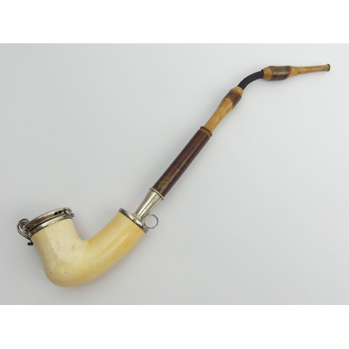 454 - A C.1850 German or Austrian meerschaum elbow pipe with silver mounts and lid, cherrywood stem and st... 