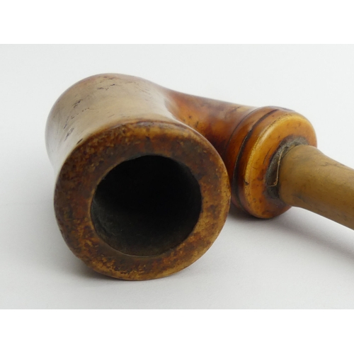 456 - A small C.1900 meerschaum elbow pipe with wood and staghorn stem,
Overall length 39 cm. UK Postage £... 