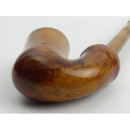 456 - A small C.1900 meerschaum elbow pipe with wood and staghorn stem,
Overall length 39 cm. UK Postage £... 