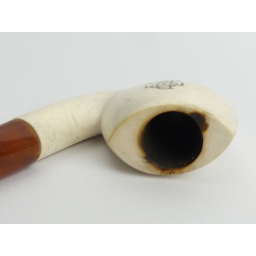 457 - A pre-smoked meerschaum pipe with an amber mouthpiece. UK Postage £12.