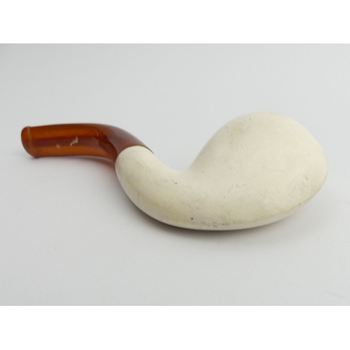 457 - A pre-smoked meerschaum pipe with an amber mouthpiece. UK Postage £12.