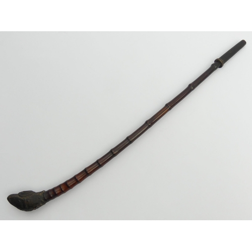 633 - 19th century bamboo opium pipe from Southeast Asia with brass mounts, 42cm. UK Postage £12.