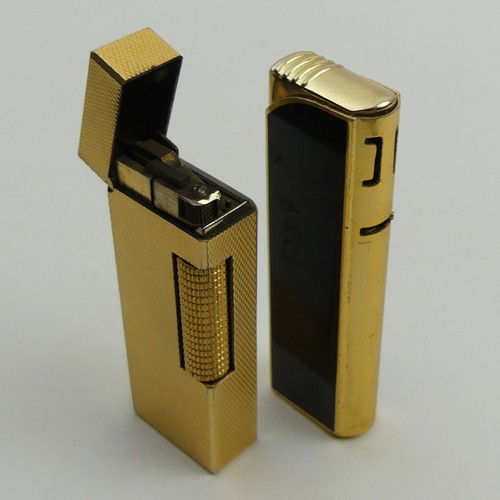 628A - Two vintage lighters, one Dunhill rollergas and a black enamelled Colibri. UK Postage £12.