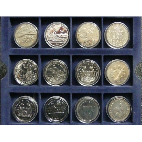 200E - A presentation box of 25 royal commemorative and other coins including some silver examples. UK Post... 