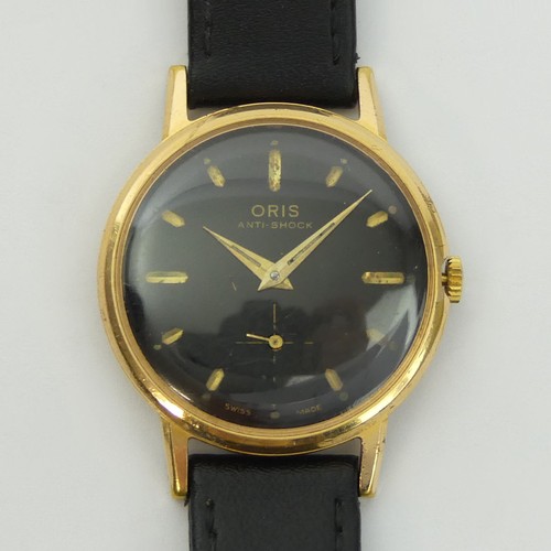 130 - Oris gold tone black face, anti-shock movement gents watch on a leather strap, 34mm inc. crown. UK P... 