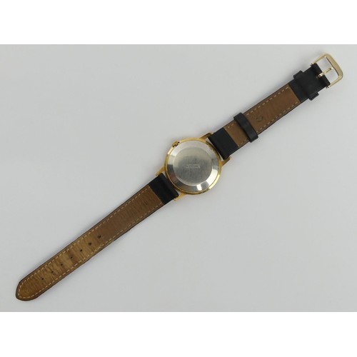 130 - Oris gold tone black face, anti-shock movement gents watch on a leather strap, 34mm inc. crown. UK P... 