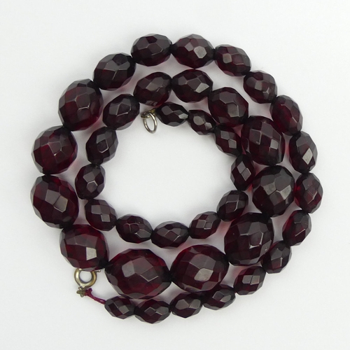 15 - Cherry amber/Bakelite faceted bead necklace, 28.6 grams, 14mm x 19mm largest bead, 48cm long.