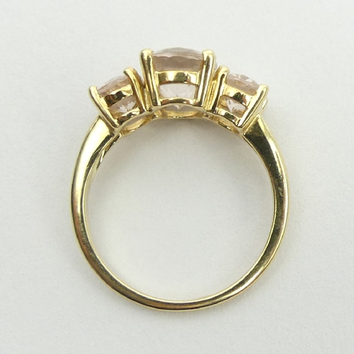 11 - 9ct gold three stone pink quartz ring, 3.1 grams, 9.1mm, size N.